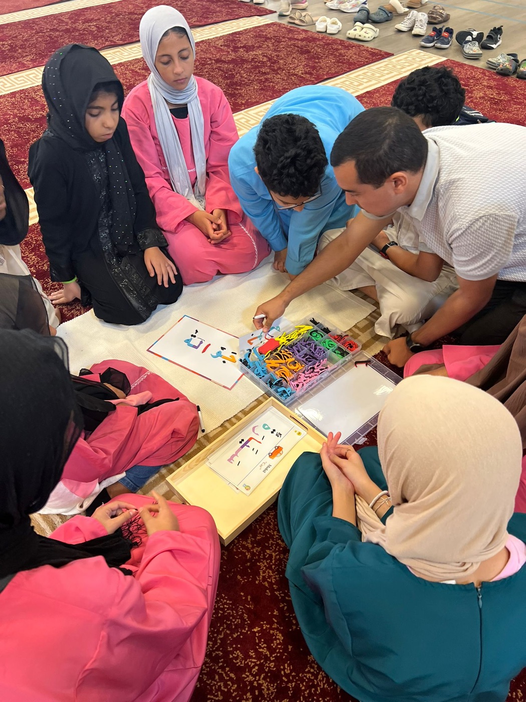 Students using Arabic letter activity
