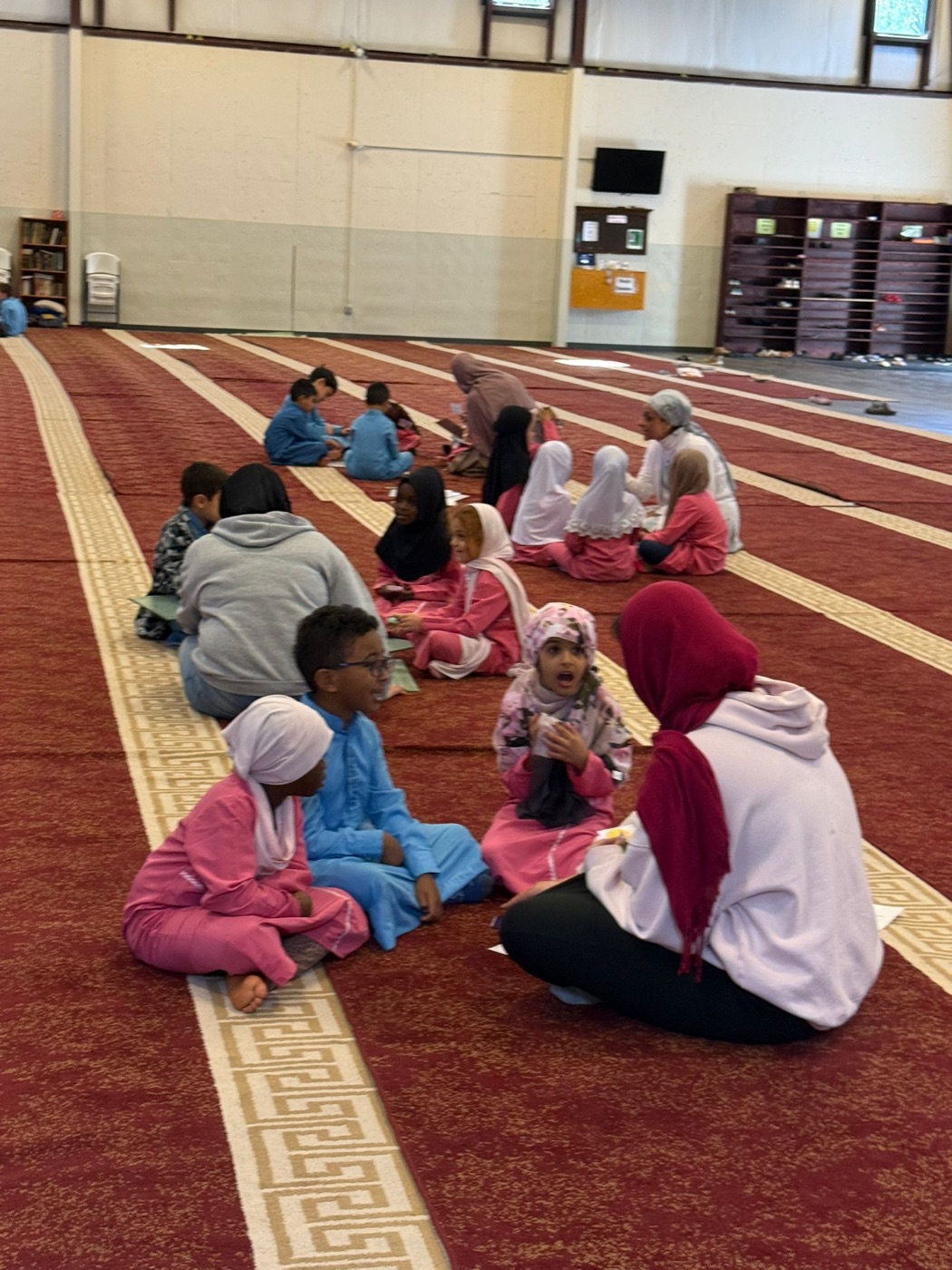 Students with Qur'an at year-end ceremony